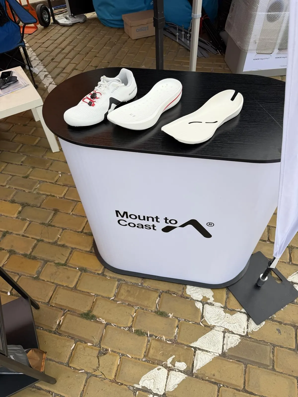 Mount to Coast running shoe with separate midsole and insole displayed on the branded counter